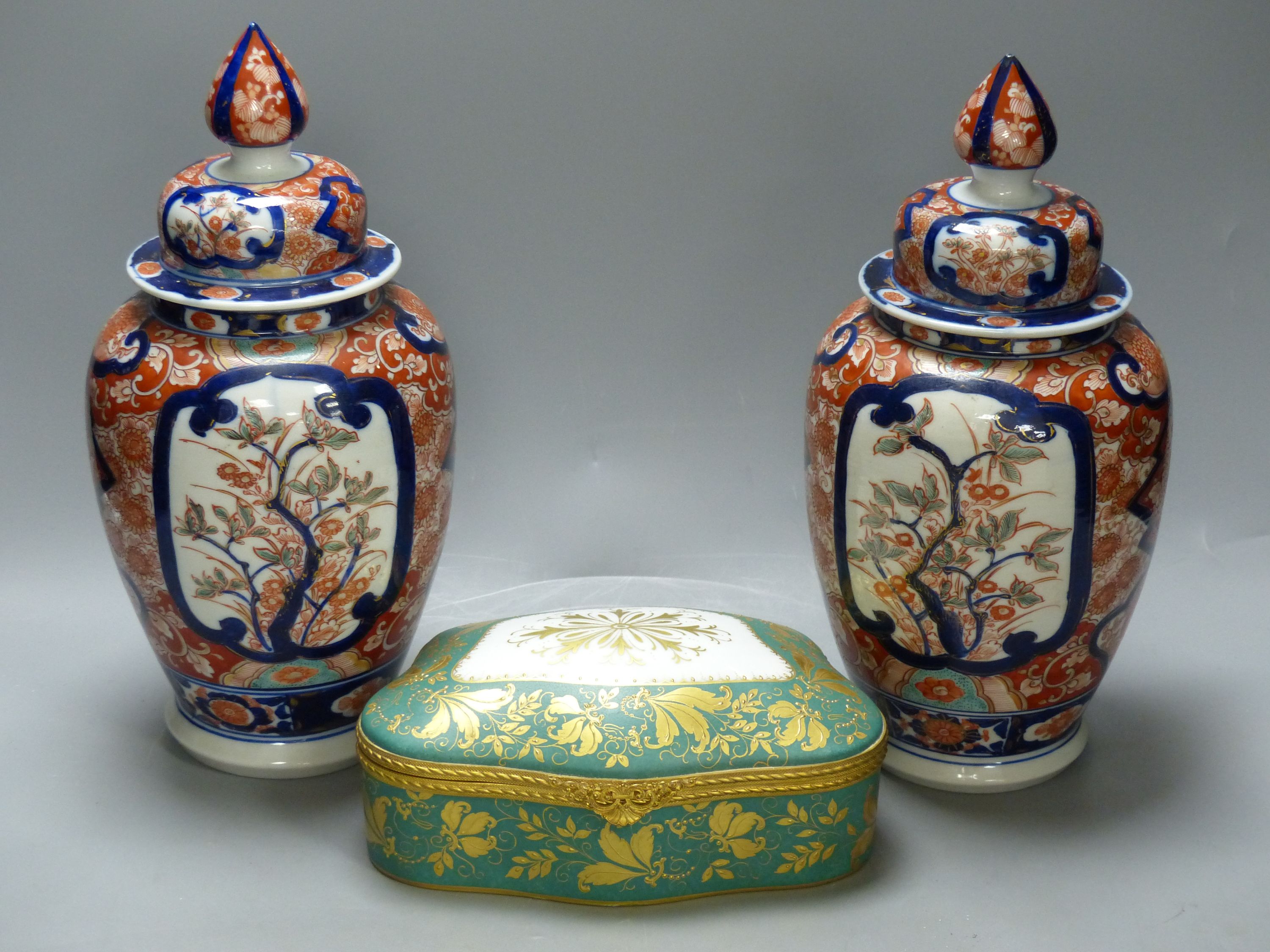 A pair of Imari vases and covers and a Limoges box, height 30cm